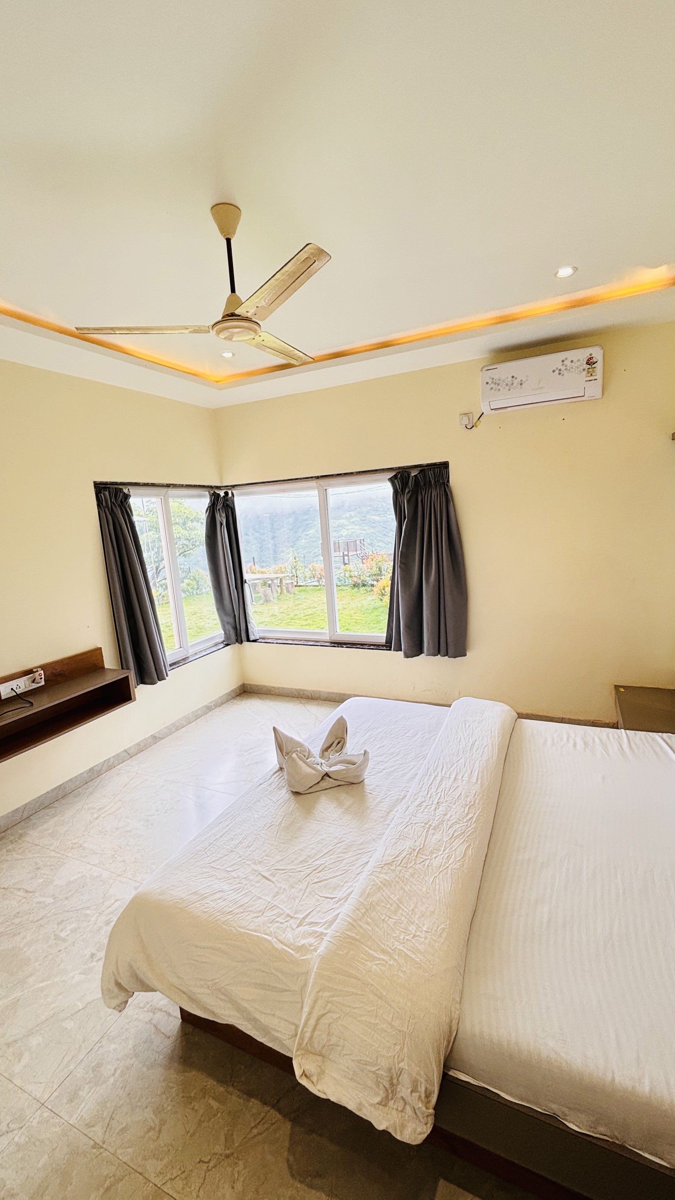 Bedroom with garden view at Paramount's Vinayaka Panchgani