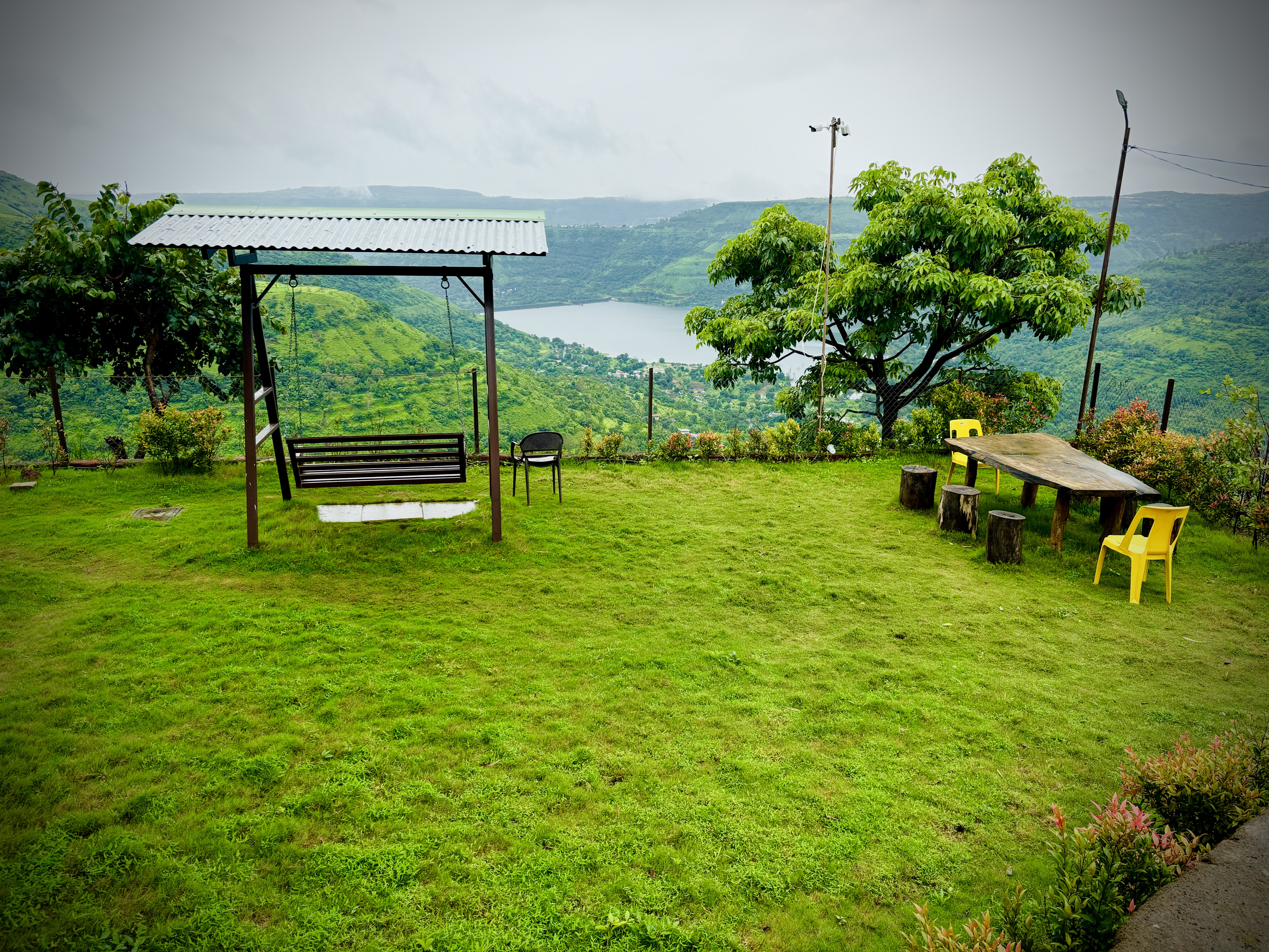 Garden lawn with swing and Dhom Dam view — Paramount's Vinayaka Panchgani