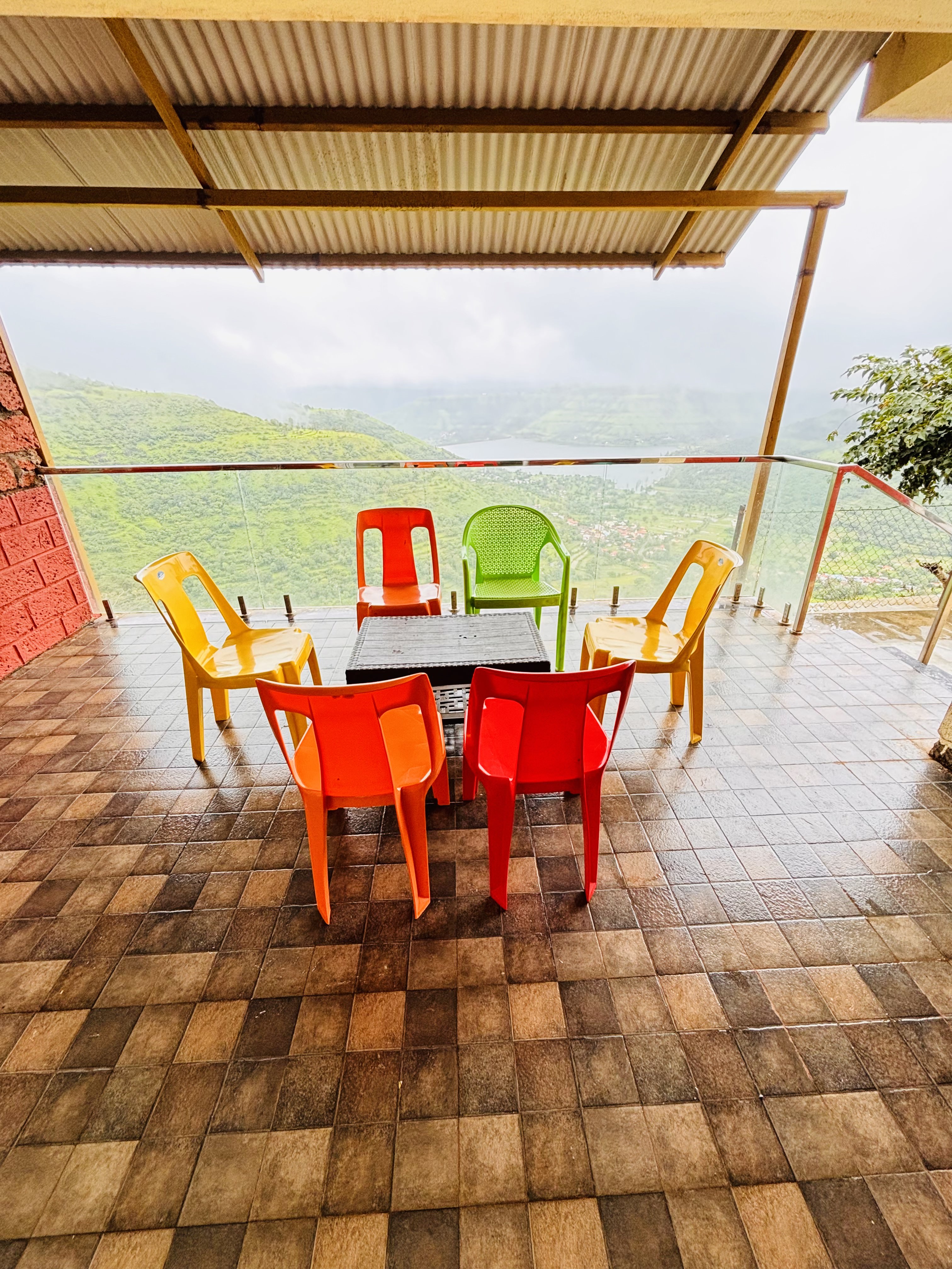 Outdoor dining area with Western Ghats view at Panchgani villa