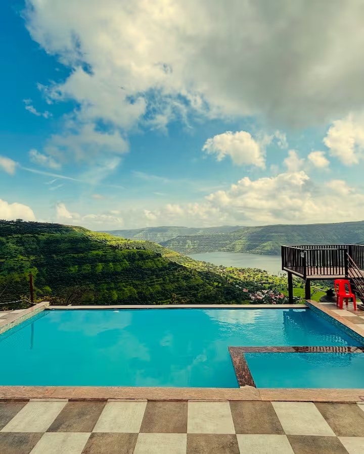 Infinity pool with Dhom Dam view — Paramount's Vinayaka Homestay Panchgani